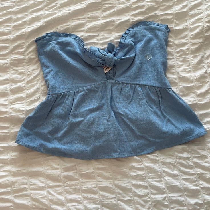 Cute Blue Strapless Pacsun Top. Never Worn. Size S But Probably Need A Bigger Chest To Keep It Up Or Need To Add Straps To It Light Wash Top For Beach In Summer, Light Wash Summer Beach Top, Chic Light Wash Tops For Beach, Light Blue Sleeveless Halter Top For Spring, Chic Light Wash Tops For The Beach, Chic Light Wash Beach Tops, Blue Cropped Tube Top For Summer, Summer Bandeau Top For Brunch, Summer Bandeau Top For Day Out