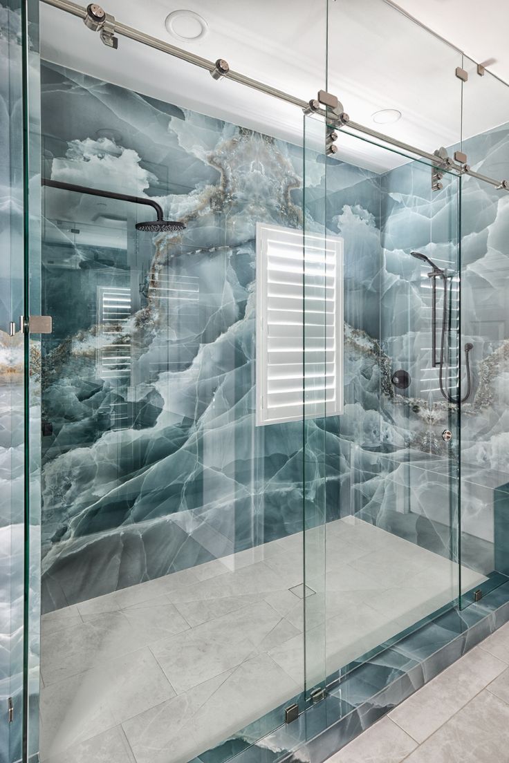 Standing shower in a bathroom remodel with blue marble and stainless steel decor Onyx Tile Bathroom, Onyx Bathroom Ideas, Blue Marble Bathroom, Stainless Steel Decor, Marble Bathroom Decor, Steel Decor, Outdoor Interior, Crystal Bathroom, Bathroom Design Styles