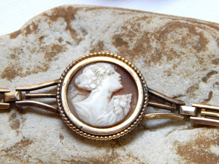 Antique cameo bracelet antique jewelry gold jewlery cameos vintage cameos cameo vintage jewelry Listing is for the Bracelet only 12K Gold Filled This is a beautiful piece in nice vintage condition. It could use some polishing and the cameo itself could be cleaned. I don't know the age of this piece but i would estimate that it about 100 years old. The earring will be listed soon. Bracelet measures 7.75 inches long the cameo itself is 18mm's in diameter Feel free to ask any questions.. I gladly d Edwardian Bracelet, Filigree Bangle, Multi Chain Bracelet, Flower Cuff Bracelet, Cameo Bracelet, Edwardian Jewelry, Art Deco Bracelet, Antique Gold Jewelry, Cameo Jewelry