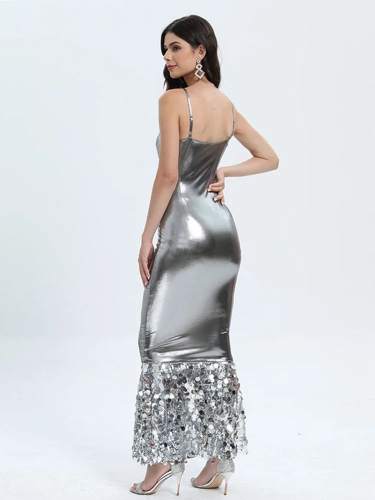 Introducing our captivating Silver Patchwork Sequin Maxi Dress, a stunning masterpiece that combines elegance with a touch of allure. This dress is designed to make you stand out at any event, whether it's a glamorous party, wedding, evening soiree, cocktail affair, or a red carpet event. Crafted with meticulous attention to detail, this dress offers a host of exceptional features. The breathable and sustainable polyester fabric ensures comfort, while its slight stretch provides just the right amount of flexibility for ease of movement. The spaghetti strap sleeve style adds a delicate and sophisticated touch, allowing you to showcase your shoulders gracefully. The slim fit silhouette accentuates your curves, and the ankle-length design adds a touch of drama and flair to your look. The squa Glamorous Long Sequin Party Dress, Gala Party Maxi Dress, Sleeveless Bodycon Dress For Gala Party Season, Glamorous Long Holiday Dress, Evening Party Sequin Maxi Dress, Sequined Fitted Bodycon Dress For Wedding, Evening Party Maxi Dress With Sequins, Fitted Sequin Bodycon Dress For Wedding, Chic Sequin Dress For Prom Gala