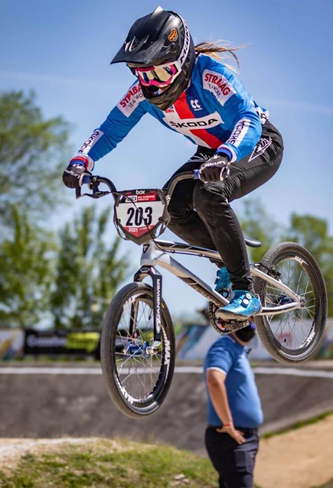 a person on a bike doing a trick in the air