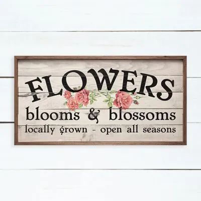 a wooden sign that says flowers blooms and blossoms locally grown - open all seasons