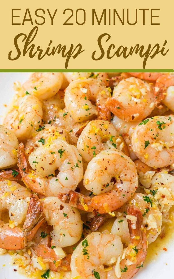 shrimp scampp with lemon sauce and parsley on the side in a white plate