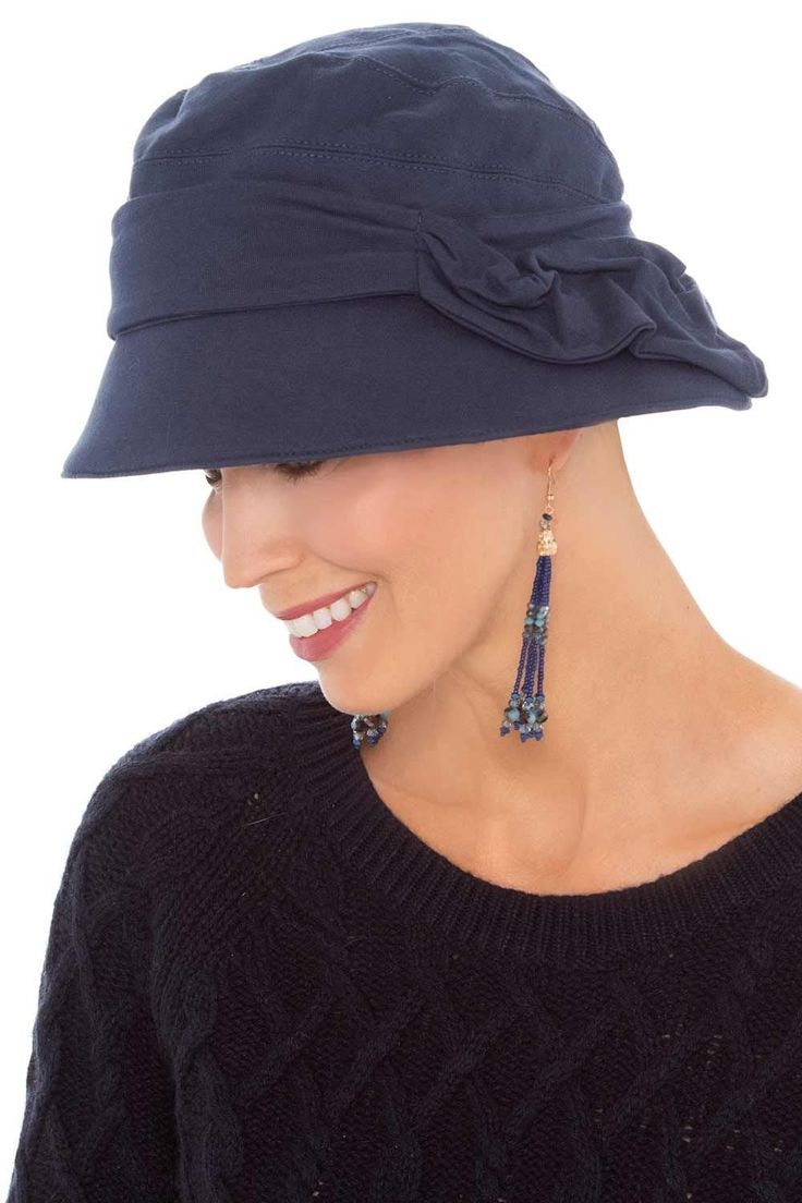 Inspired by Paris in the 1920's, this unique cloche hat is positively chic. The asymmetrical brim and abstract side detail give a sophisticated vintage look. The soft and durable 100% cotton exterior provides UPF 50+ coverage to give excellent sun protection. The lining of this cap features an exclusive blend of viscose and Aloe Vera. Unlike other Aloe Vera fabrics on the market which merely have an Aloe Vera coating that washes off over time, the fabric of this hat features real Aloe Vera fiber Chic Adjustable Cloche Hat For Kentucky Derby, Adjustable Cloche Hat In Flapper Style, Adjustable Wide Brim Flapper Hat, Adjustable Cloche Flapper Hat, Flapper Style Cloche Hat For Kentucky Derby, Kentucky Derby Flapper Cloche Hat, Bamboo Hats, Cadet Hat, Flapper Hat