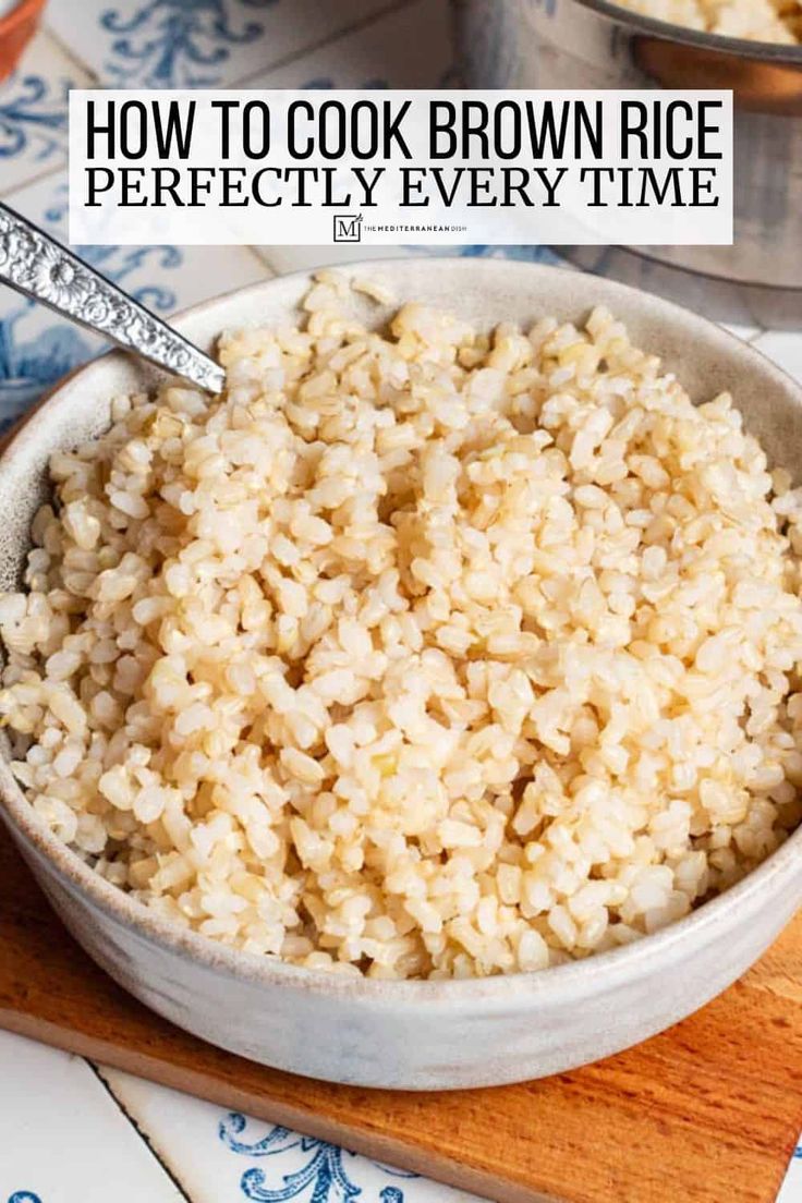 brown rice in a bowl on a cutting board with the words how to cook brown rice perfectly every time