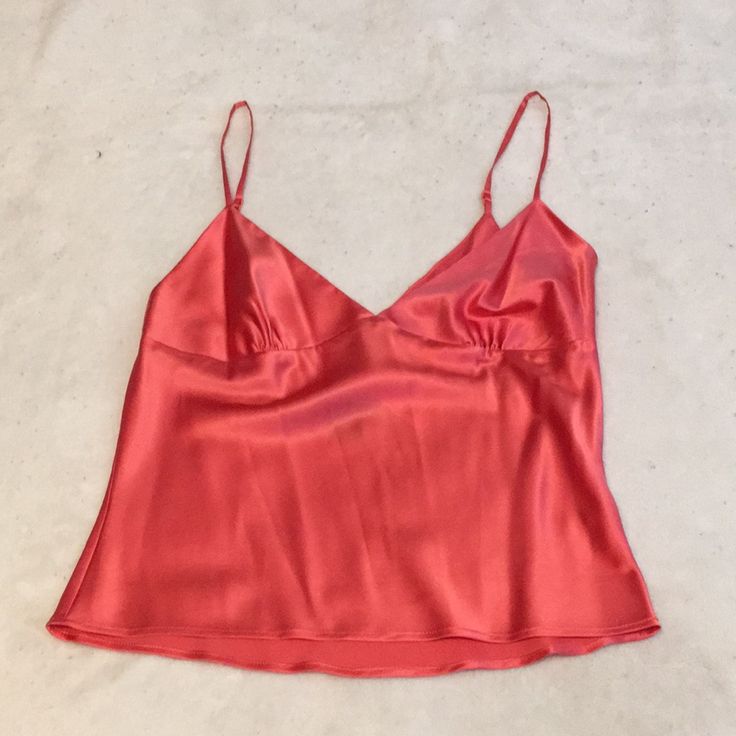 This Luxurious Silk Camisole Is By Moda International. It Is A Size Small And Features Adjustable Spaghetti Straps And An Invisible Side Zipper. It Is A Beautiful Shade Of Salmon And Is 92% Silk And 8% Spandex For A Comfy Fit. Elegant Pink Camisole With Built-in Bra, Elegant Pink Tops With Built-in Bra, Pink Spaghetti Strap Camisole With Built-in Bra, Chic Fitted Pink Tank Top, Pink Camisole For Spring Party, Pink Cami Tank Top With Built-in Bra, Spring Night Out Camisole With Built-in Bra, Pink Party Tops With Built-in Bra, Pink Camisole With Delicate Straps