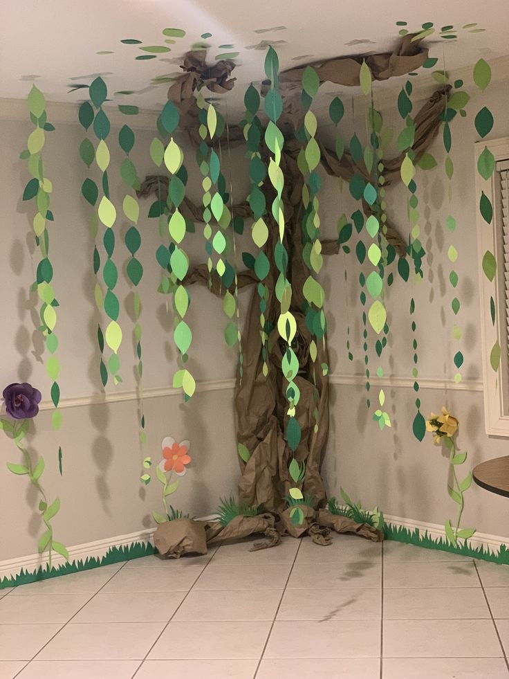 a room decorated with paper trees and flowers