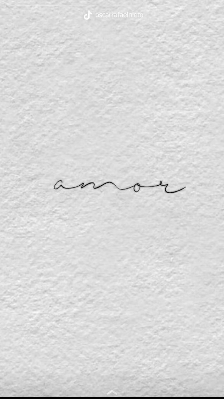 the word love written in cursive writing on white paper