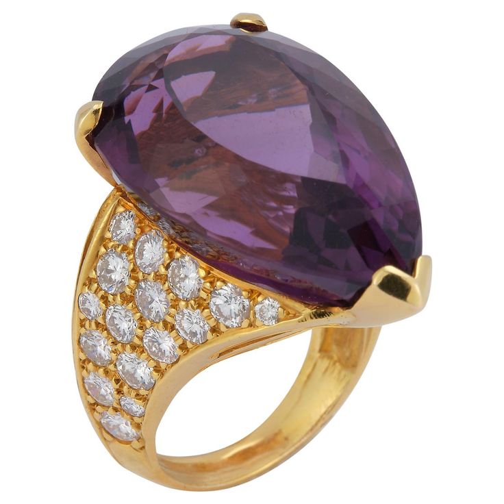 Huge Pear Shape Amethyst Cocktail Ring 1 large amethyst set in 3 prong setting surrounded by 50 round cut diamonds approximately 3.86 cts set in 14k yellow gold. Ring Size: 5 Re sizable free of charge Amethyst Cocktail Ring, Amethyst Set, David Webb, Amethyst And Diamond Ring, Diamond Cocktail Rings, Cocktail Ring, Round Cut Diamond, Pear Shape, Cocktail Rings