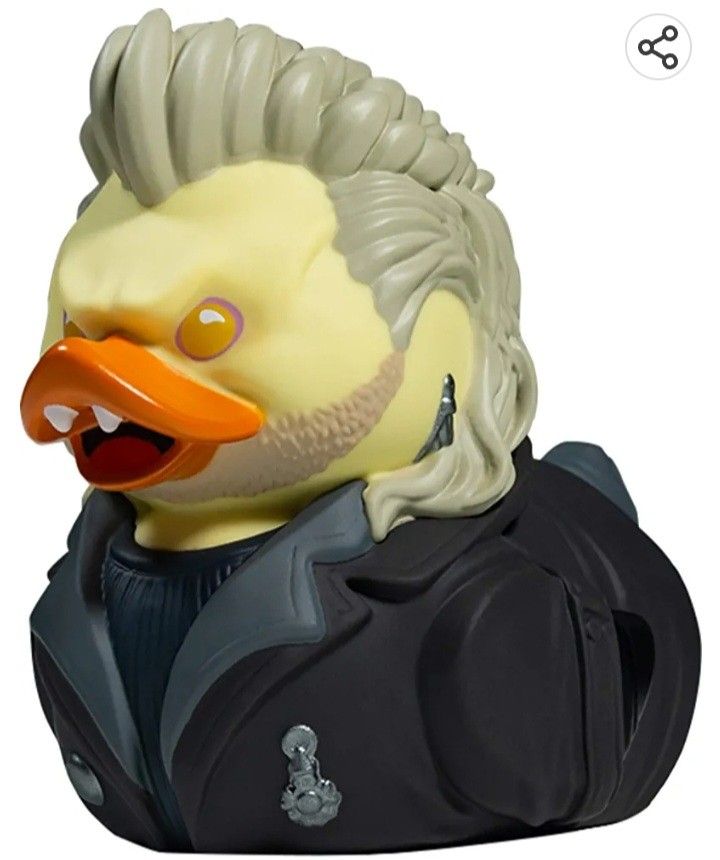 a rubber duck with a wig on top of it's head and eyes open