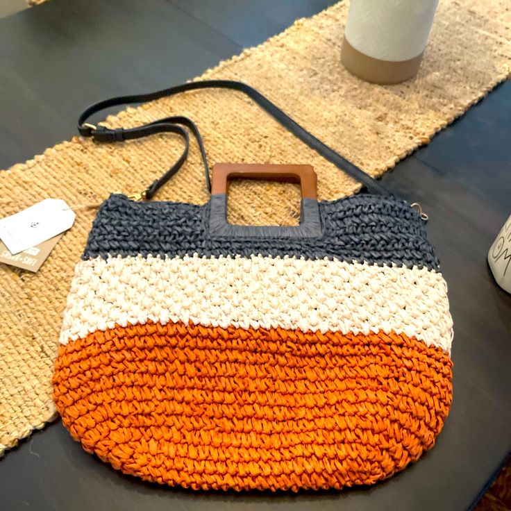 This Bag Is Brand New And Adorable! Perfect Addition To Any Summer Outfit. The Bag Is Lined And Can Be Held By The Cute Wooden Handles Or Useful Shoulder Strap. Trendy Orange Shoulder Bag For Vacation, Casual Orange Shoulder Bag With Handles, Rectangular Orange Crochet Bag For Vacation, Orange Shoulder Bag With Adjustable Strap For Vacation, Orange Satchel Bag For Vacation, Orange Satchel Bag For Summer, Orange Straw Bag For Everyday Summer Use, Orange Satchel Shoulder Bag For Vacation, Orange Bags For Everyday Summer Use