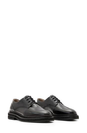 Bring a menswear-inspired edge to your looks with this classic derby. 1 1/4" heel Lace-up style Leather upper and lining/synthetic and rubber sole Made in Portugal Classic Office Lace-up Shoes With Contrast Sole, Workwear Oxfords With Contrast Sole, Workwear Lace-up Cap Toe Shoes With Contrast Sole, Moc Toe Oxfords With Contrast Sole For Work, Workwear Lace-up Shoes With Contrast Sole, Cap Toe Lace-up Shoes With Contrast Sole For Work, Classic Oxfords With Contrast Sole For Office, Classic Leather Shoes With Contrast Sole For Derby, Office Dress Shoes With Contrast Sole And Plain Toe