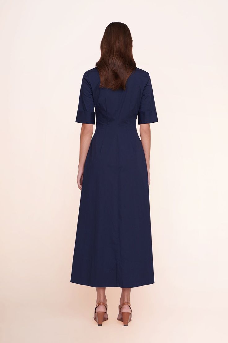 A maxi shirt dress made out of stretchy cotton poplin, the Joan Dress is a modern yet polished take on a classic. Chic Cotton Maxi Shirt Dress, Navy Cotton Midi Dress, Elegant Navy Cotton Dress, Fitted Maxi Length Cotton Shirt Dress, Fitted Cotton Maxi Shirt Dress, Cotton Fitted Maxi Dress For Work, Fitted Cotton Maxi Dress For Work, Navy Cotton Dress For Work, Maxi Shirts