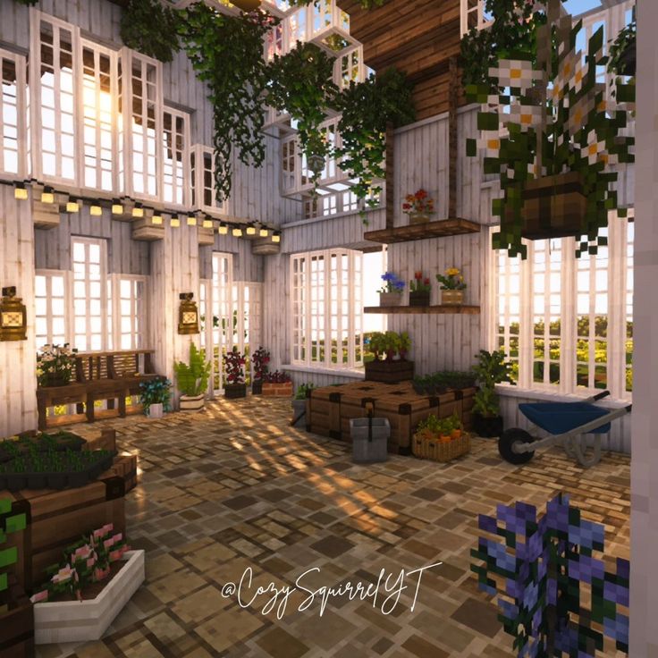 a large room with lots of windows and plants