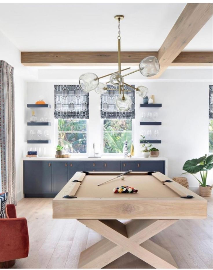 a pool table in the middle of a living room