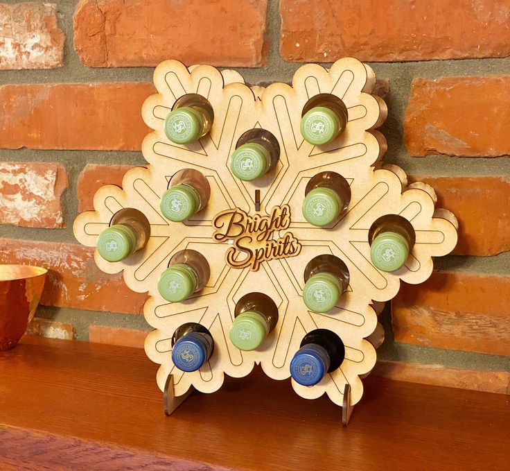 a wooden wine rack with several bottles in it on a shelf next to a brick wall