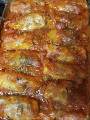 a casserole dish with meat and tomato sauce