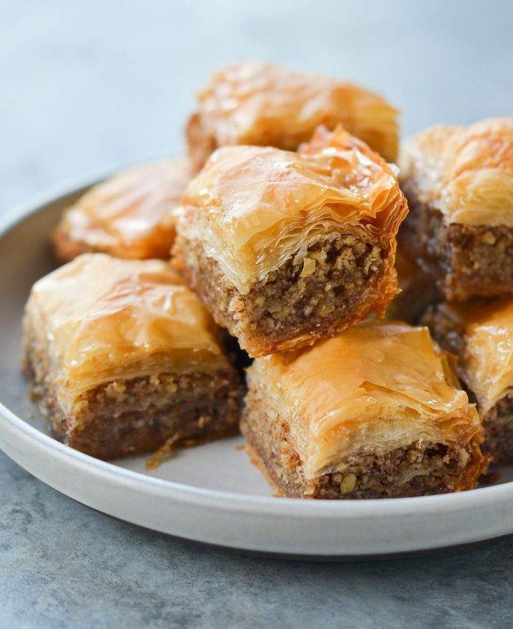 a white plate topped with pastries on top of a table