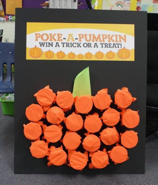 an orange pumpkin made out of toilet paper with a trick or treat sign in the background