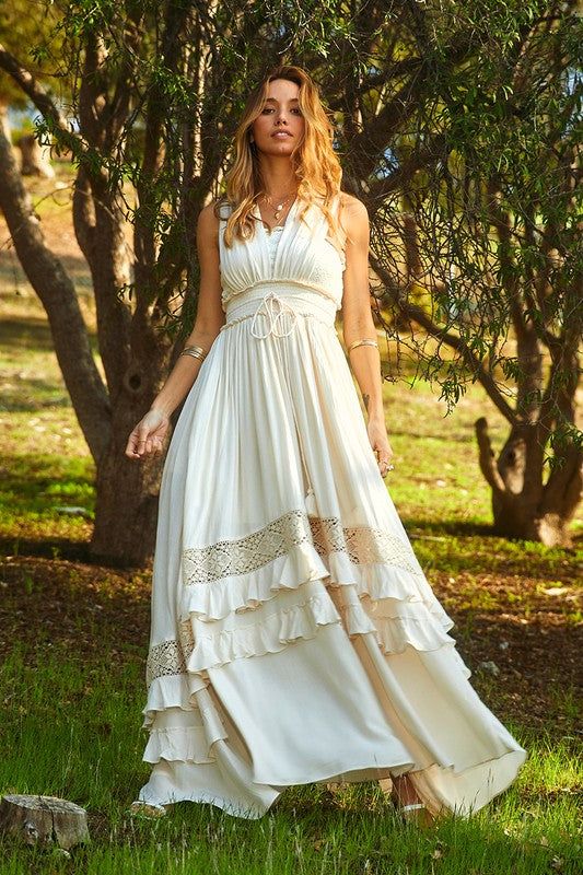 Beautiful boho long dress perfect for photoshoot, summer vacation, beach or any other occasion. Deep V maxi with ruffles tiers along maxi, smocked waist comes with lace inset.Color: Natural IvoryMaterial: 100% RayonLength: 53 inches long dress's shoulder to the bottom Athena Dresses, Bohemian Summer Dresses, Charlotte Dress, Boho Dresses Long, Victoria Dress, Maxi Gowns, Western Dresses, Beautiful Wedding Dresses, Flowy Dress