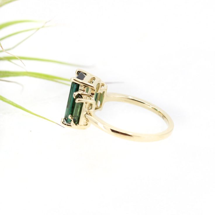 The showstopper. Three lush luxurious AA green tourmalines are set in slim claw settings and sit atop a classic round band. Classic with a twist, this art deco inspired piece makes a fantastic statement ring or a wedding piece. Metaphysically, green tourmaline carries the essence of the earth and her plant kingdom. It's conducive to healing, happiness, and setting a clear & grounded direction for the future. 3.79 ctw AA green tourmaline and solid 14k yellow gold. US size 7 but can be resized Plant Kingdom, Jewelry Studio, Art Deco Inspired, Green Tourmaline, Of The Earth, Statement Ring, The Earth, Tourmaline, Statement Rings