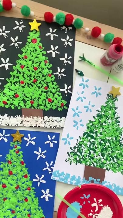 paper plates with christmas trees on them next to crafting supplies