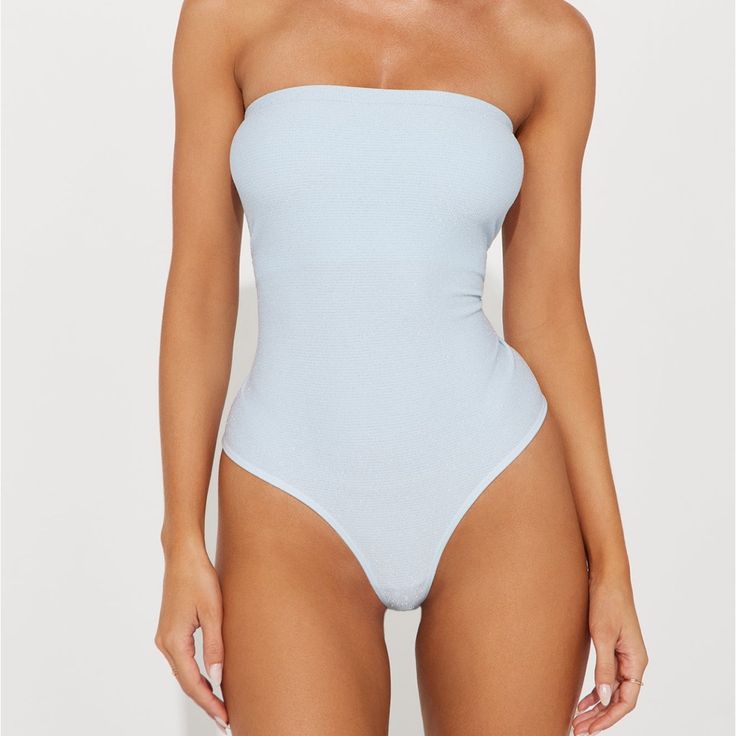 Brand New Never Worn Chic Blue Bodysuit For Spring, Strapless Bodysuit For Beach In Spring, Strapless Beach Bodysuit For Spring, Spring Light Blue Stretch Bodysuit, Chic Blue Stretch Bodysuit, Strapless Bodysuit For Poolside Summer, Summer Light Blue Bodysuit For Poolside, Chic Light Blue Swimwear For Summer, Chic Light Blue Fitted Swimwear