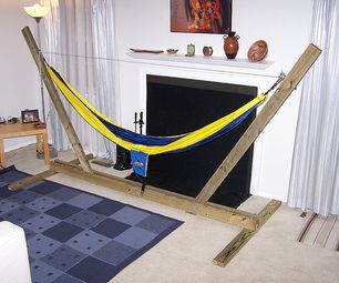 a living room filled with furniture and a yellow hammock hanging from the ceiling