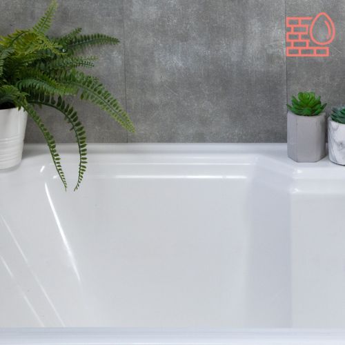 three potted plants sit on the edge of a bathtub