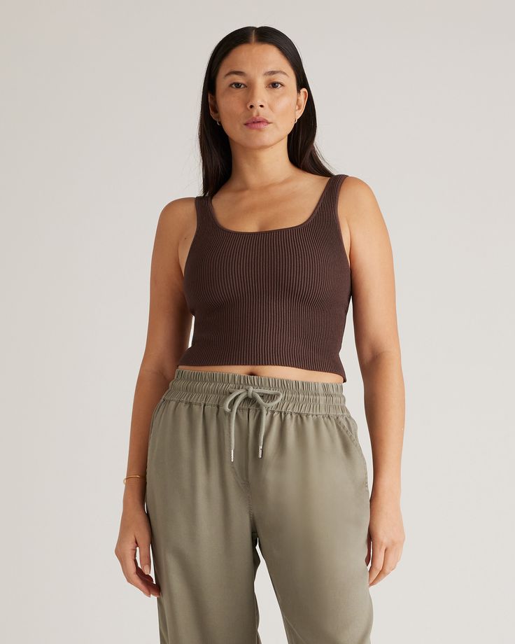 You found it, a tank top that hugs in all the right places. Ottoman stitching gives this sweater knit tank its structured style and textured feel with the perfect amount of stretch and softness for all-day comfort. Also available in a Halter, One Shoulder, High Neck, and Polo silhouette.  | Quince | Women's Cropped Square Neck Ribbed Knit Tank Top in Dark Brown, Size XS, Recycled nylon/polyester/spandex Minimalist Summer Wardrobe, Minimalist Summer, Summer Wardrobe Essentials, Sweater Crop, Wide Leg Linen Pants, Ribbed Crop Top, Knit Tank, Curvy Outfits, Softest Sweater