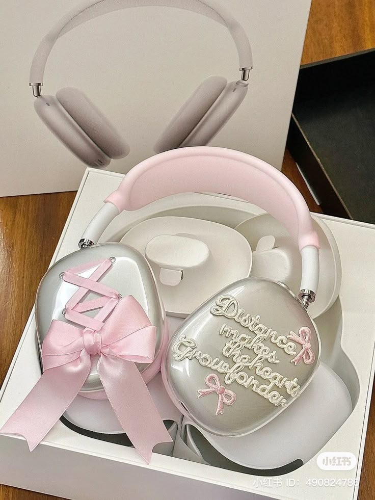 a box with headphones and a pink ribbon on it that says, i love you to the moon and back