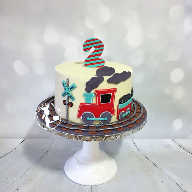 a birthday cake with a train theme on it