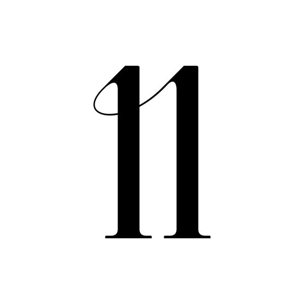 the number 11 is made up of two black letters and one has a string on it