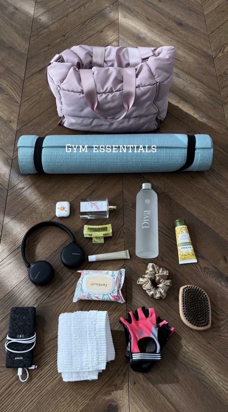 gym essentials laid out on a wooden floor