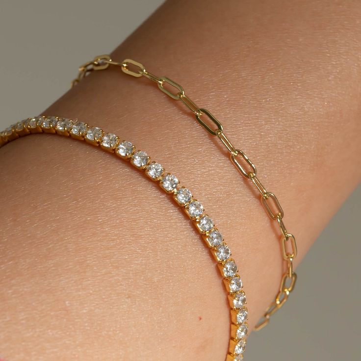 Our Paperclip bracelet is a golden staple to wear alone or stack with our other gold filled bracelets. Our 14k gold-filled jewelry is bonded with 14k gold and is water and tarnish resistant. 14k gold-filled jewelry is a great alternative to solid gold, and can be worn by people with sensitive skin. The color will not tarnish but recommend to keep away from perfumes and lotions. - 14k gold-filled- Chain width: 3.5 mm.- Chain length: 6"- Water resistant / Tarnish resistant / Hypoallergenic Gold Diamond Bracelet Tarnish Resistant For Everyday, Gold Minimalist Diamond Bracelet For Everyday, Minimalist Gold Diamond Bracelet For Everyday, Gold Tarnish Resistant Diamond Bracelet For Everyday, Everyday Gold Plated Tennis Bracelet, Everyday Paperclip Gold Bracelet, Dainty 14k Gold Tennis Bracelet For Everyday Wear, Dainty 14k Gold Tennis Bracelet, Tarnish Resistant, Everyday Gold Tarnish Resistant Tennis Bracelet