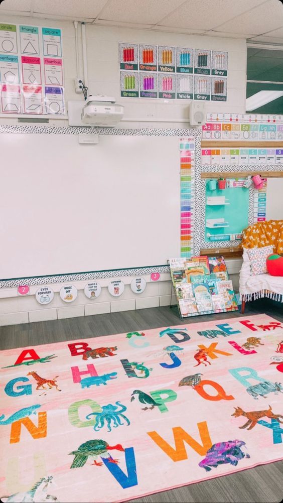 a child's room with colorful rugs and toys on the floor in front of a whiteboard