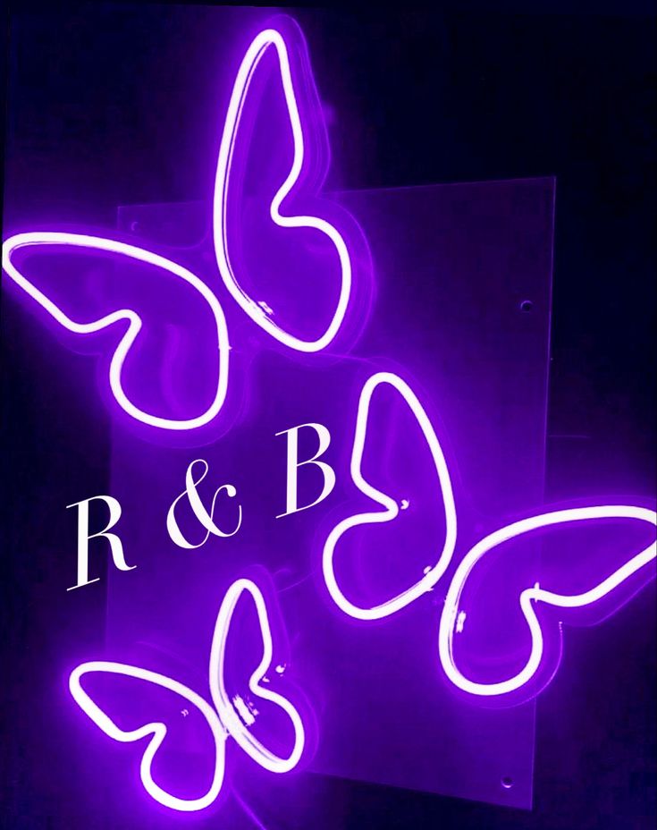 a purple neon sign that says r & b and butterflies on the side of it