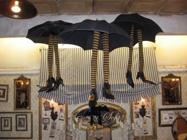 an umbrella hanging from the ceiling in a room