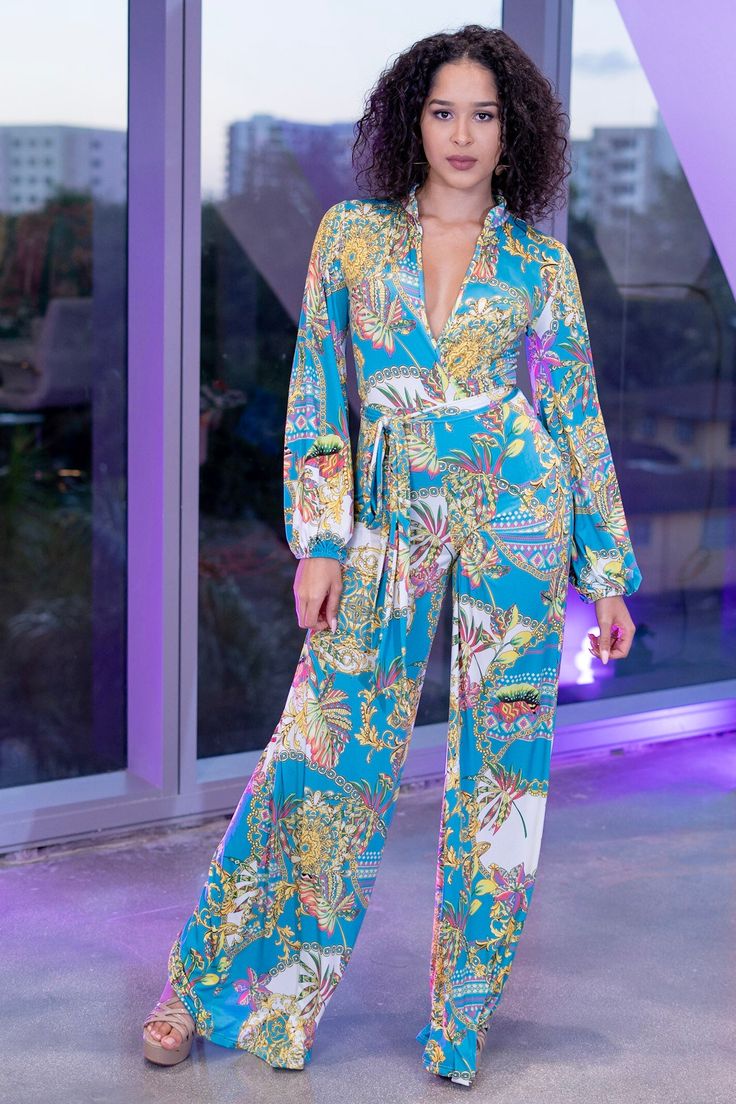 Paisley Print turquoise blue wide leg jumpsuit with a collar and long sleeve. Wear it with a high waist or regular waist for a slimming look, add a solid blazer for professional look. Elegant Floral Print Jumpsuits And Rompers For Night Out, Long Sleeve Jumpsuits And Rompers For Summer Formal Events, Chic Floral Print Maxi Jumpsuits And Rompers, Elegant Floral Print Jumpsuits And Rompers, Chic Wide Leg Jumpsuits And Rompers With Floral Print, Trendy Printed Long Sleeve Jumpsuits And Rompers, Trendy Printed Jumpsuits And Rompers With Long Sleeves, Chic Printed Jumpsuits And Rompers For Party, Floral Print Long Sleeve Jumpsuits And Rompers For Party