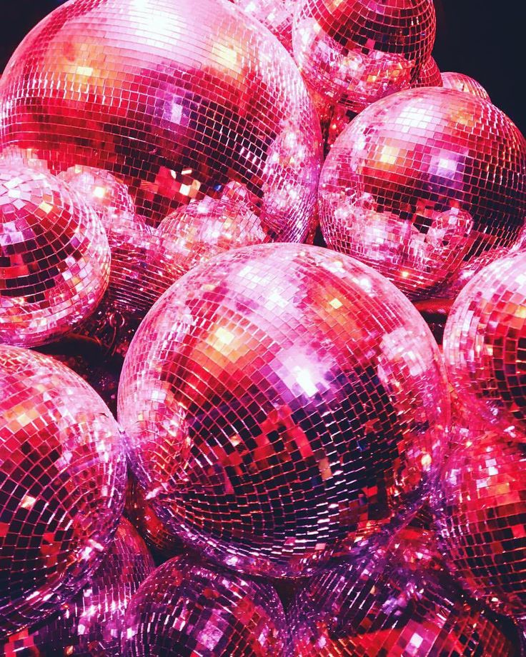 many shiny disco balls piled on top of each other