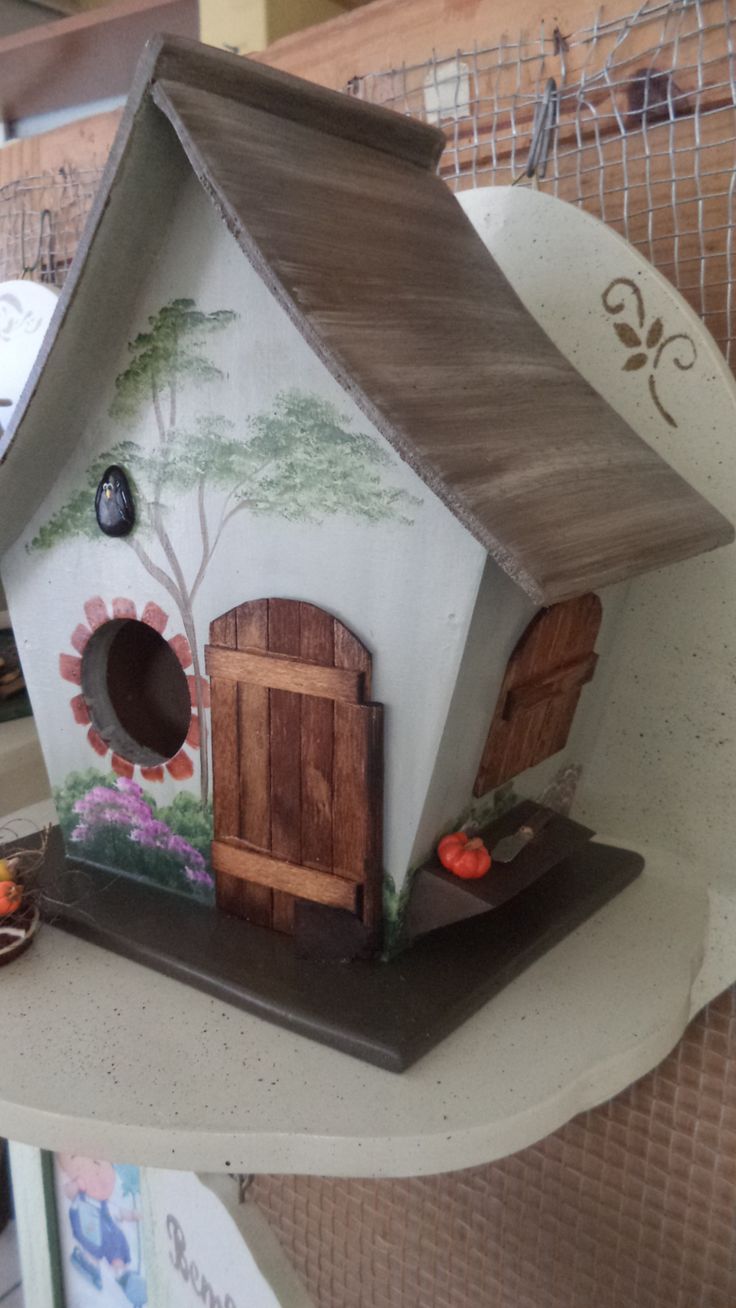 a bird house on a shelf in a store