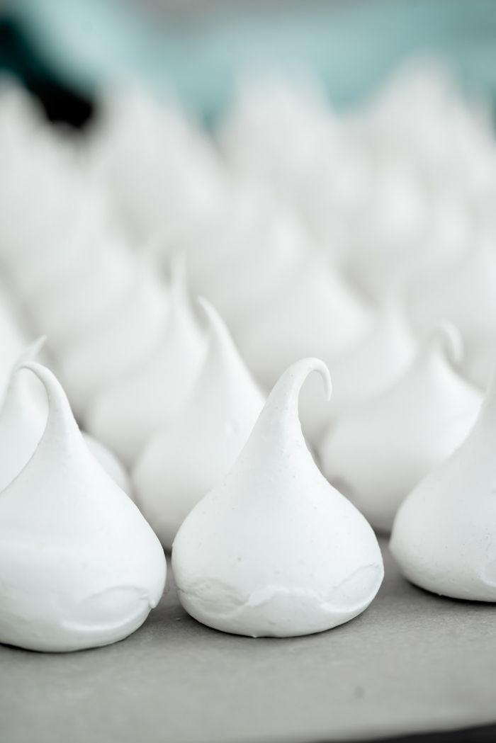 some white icing sitting on top of a table