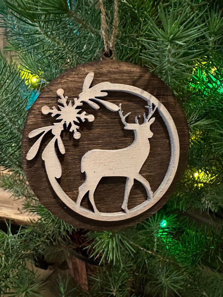 a wooden ornament hanging from a christmas tree