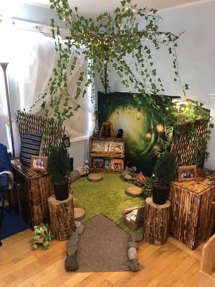 a living room filled with wooden stumps and plants