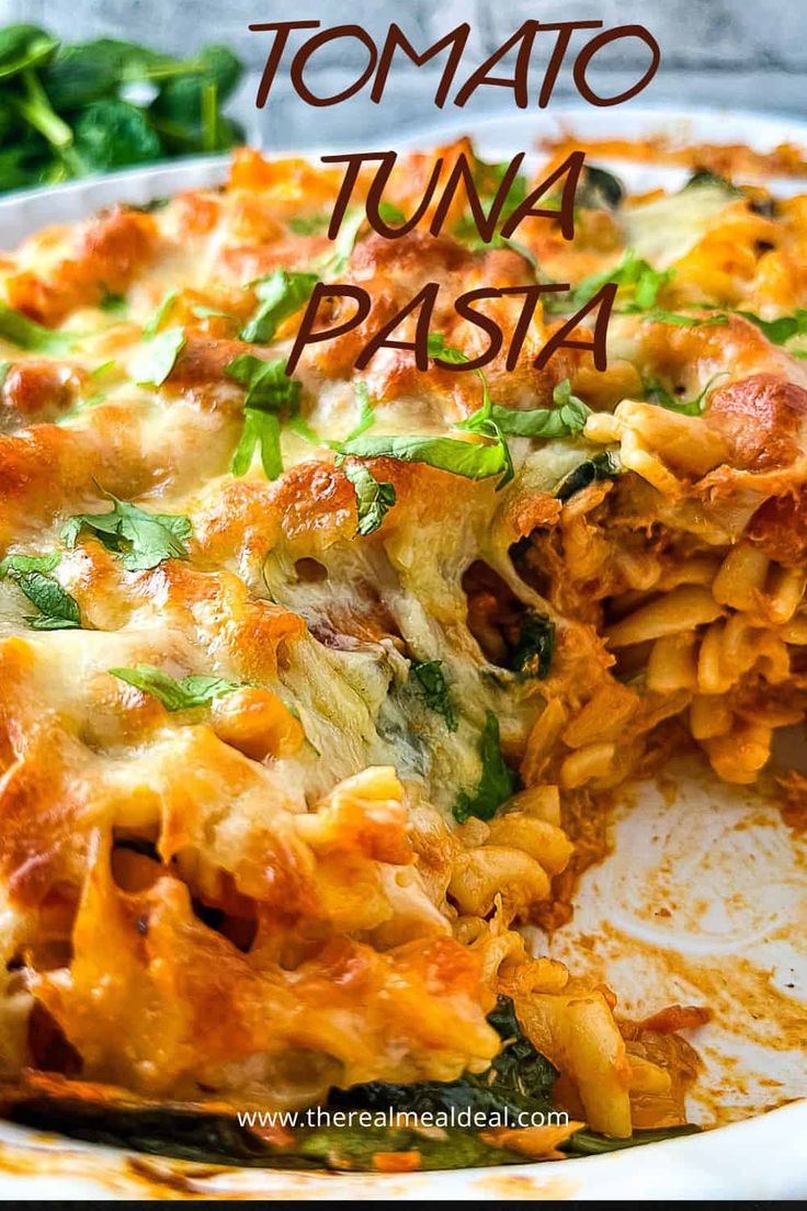 a close up of a slice of pizza on a plate with the words tomato tuna pasta