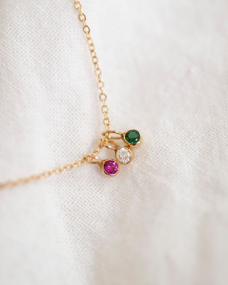 This exquisite necklace, crafted from 14k yellow or white gold, is the epitome of elegance and sophistication. A perfect keepsake to commemorate beloved family members and cherished loved ones. 14k solid gold 2mm small round bezel charm with lab created birthstone •• January—Garnet •• February—Amethyst •• March—Aquamarine •• April—White sapphire •• May—Emerald •• June—Alexandrite •• July—Ruby •• August—Peridot •• September—Sapphire •• October—Tourmaline •• November—Topaz •• December—Blue zircon Sapphire Birthstone Round Pendant Necklace, Dainty May Birthstone Necklace With Charms, 14k Gold Charm Necklace With May Birthstone Gemstone, May Birthstone Round Pendant Necklace, May Birthstone Round Necklace With Charms, Personalized Dainty 14k Gold Birthstone Necklace, Adjustable Birthstone Necklace With Gemstone, May Birthstone Round Charms Necklace, Round Birthstone Necklace For Everyday