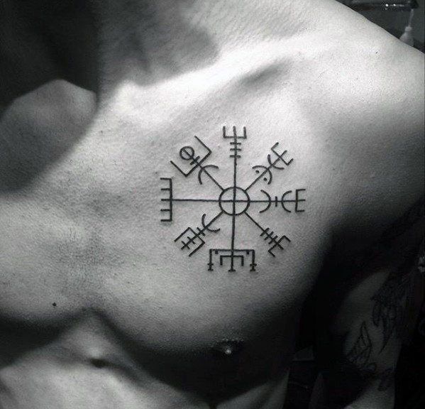 a man with a cross tattoo on his chest