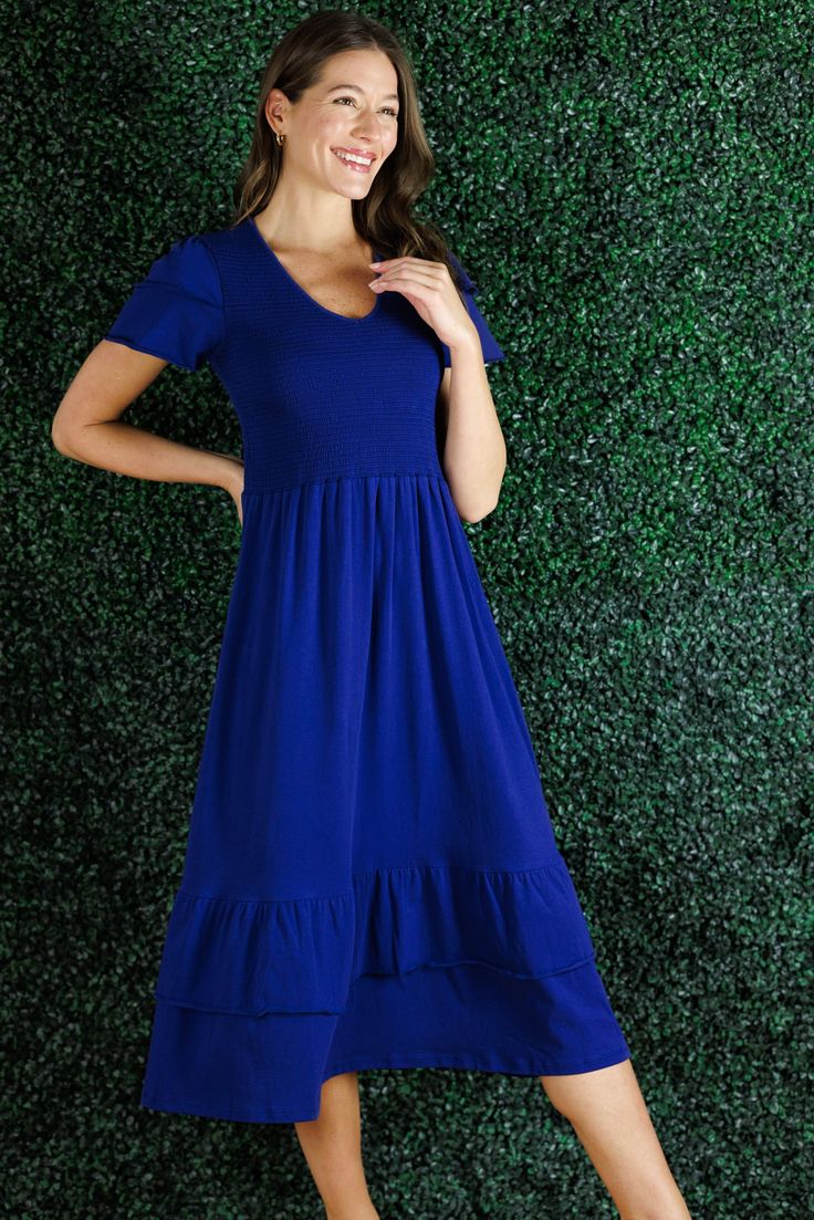 A statement dress that feels as comfortable as loungewear, sign us up! The Mattie Dress is just that and more. The smocking on the chest is so flattering and comfortable that this is going to be our go to dress for everything from vacation to date night. In a classic navy, this piece will last from season-to-season. This dress runs large, we recommend you size down. FAVORITE FEATURES: Smocked Bodice Tiered Flattering V-Neck Ruffle Sleeve Detail Midi Length Date Night In, Statement Dress, Royal Navy, Neck Ruffle, Sleeve Detail, Night In, Midi Length, Date Night, Smocking