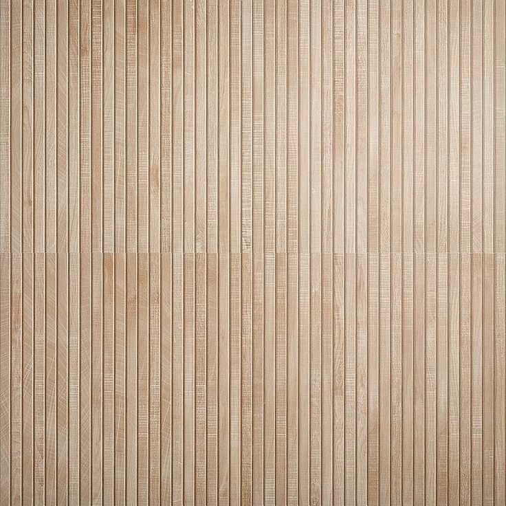 a wooden paneled wall with vertical stripes in light brown and beige tones, as well as horizontal lines on the wood