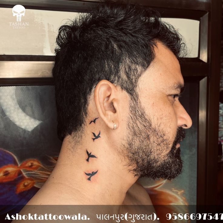 a man's neck with birds on it and the words ashkattofowla written below